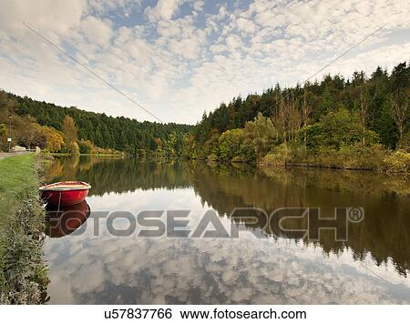 Red rowing boat on Barrow Navigation Canal, Ireland View Large Photo Image Stock Photograph - Red rowing boat on Barrow Navigation Canal, Ireland. Fotosearch