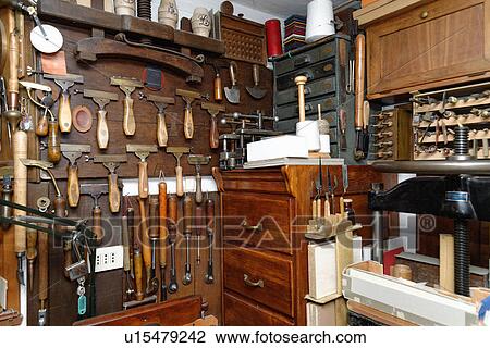 Stock Image - Selection of tools and equipment in traditional bookbinding workshop. Fotosearch