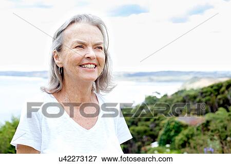 Senior woman, ocean in background, Raglan, New Zealand View Large Photo Image Stock Photo - Senior woman, ocean in background, Raglan, New Zealand. Fotosearch