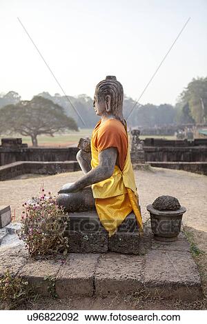 Stock Image - Side view of ancient Buddha sculpture, Siem Reap, Cambodia. Fotosearch