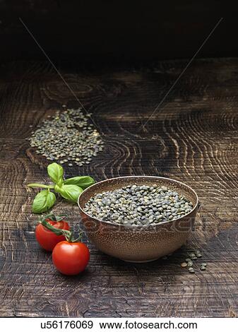Still life with vine tomatoes, fresh basil and bowl of puy lentils View Large Photo Image Stock Photo - Still life with vine tomatoes, fresh basil and bowl of puy lentils. Fotosearch