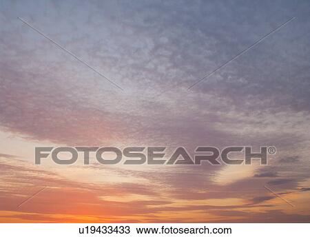 Sunset twilight clouds sky View Large Photo Image Stock Image - Sunset twilight clouds sky. Fotosearch
