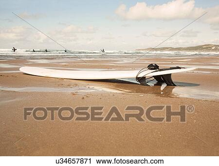 Surfboard on beach View Large Photo Image Stock Image - Surfboard on beach. Fotosearch