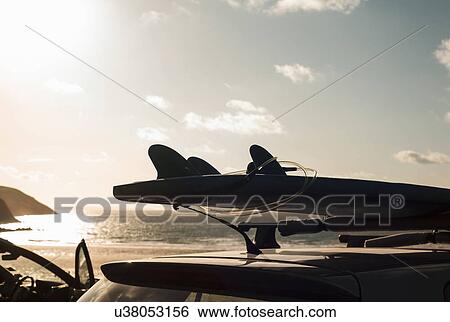Stock Photograph - Surfboards on top of car. Fotosearch