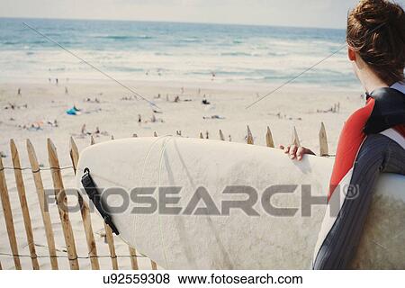 Surfer with surfboard on beach, Lacanau, France View Large Photo Image Stock Photo - Surfer with surfboard on beach, Lacanau, France. Fotosearch