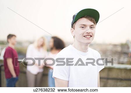 Teenage boy wearing baseball cap View Large Photo Image Stock Image - Teenage boy wearing baseball cap. Fotosearch