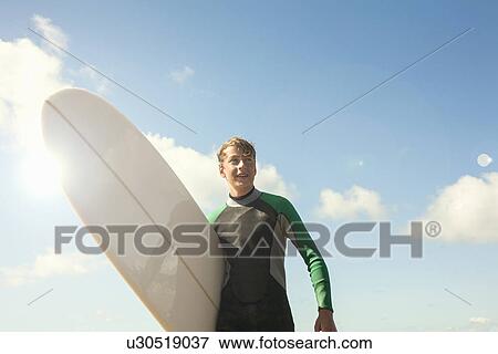 Teenage boy with surfboard View Large Photo Image Stock Photo - Teenage boy with surfboard. Fotosearch