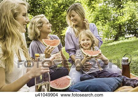 Three generation of women having picnic View Large Photo Image Picture - Three generation of women having picnic. Fotosearch