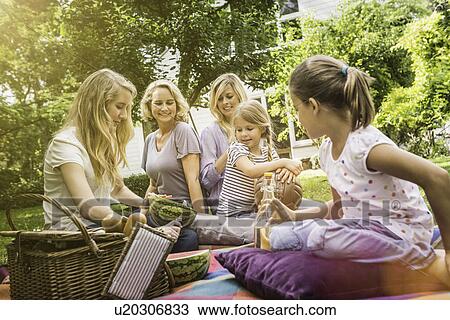 Three generation of women having picnic View Large Photo Image Stock Image - Three generation of women having picnic. Fotosearch