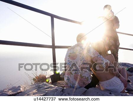 Three young adult friends on sunlit coast, Marseille, France View Large Photo Image Stock Photo - Three young adult friends on sunlit coast, Marseille, France. Fotosearch