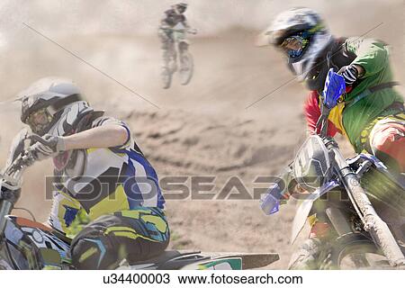 Stock Image - Three young male motocross riders racing on dusty track. Fotosearch