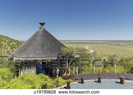 Stock Photo - Traditional tourist hut at Dolomite camp, Etosha National Park, Namibia. Fotosearch