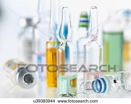 Variety of drugs including vials, ampules and vaccines illustrating medical research View Large Photo Image Picture - Variety of drugs including vials, ampules and vaccines illustrating medical research. Fotosearch