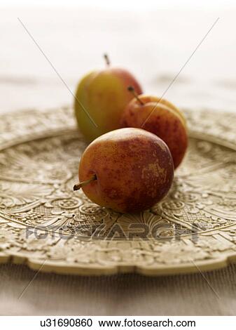 Victoria plums on decorative plate, close-up View Large Photo Image Stock Image - Victoria plums on decorative plate, close-up. Fotosearch