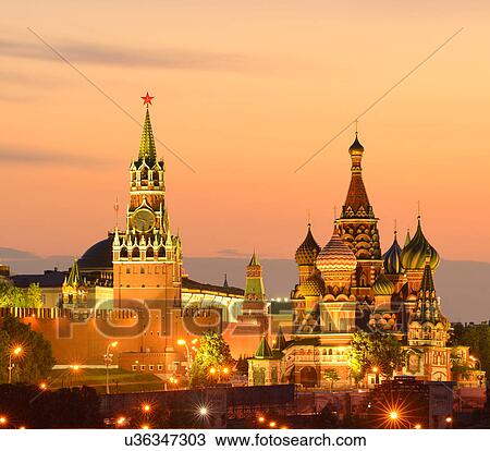 Stock Image - View of Kremlin towers, Saint Basils Cathedral at night, Moscow, Russia. Fotosearch