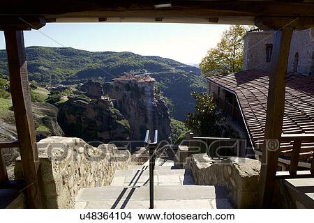 Picture - View of monastery built on rock formation from stairway, Meteora, Greece. Fotosearch