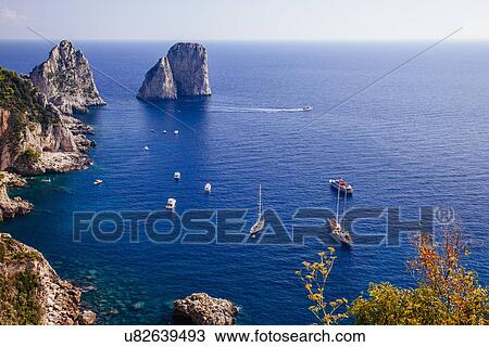 Stock Image - View of rock formations along south coast of Capri, Italy. Fotosearch