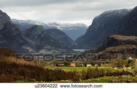 Stock Image - View of valley, houses and mountains, Rogaland County, Norway. Fotosearch