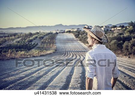Stock Photo - Viticulturist working in vineyard, Cagliari, Sardinia, Italy. Fotosearch