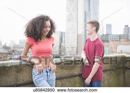 Stock Image - Young couple laughing. Fotosearch