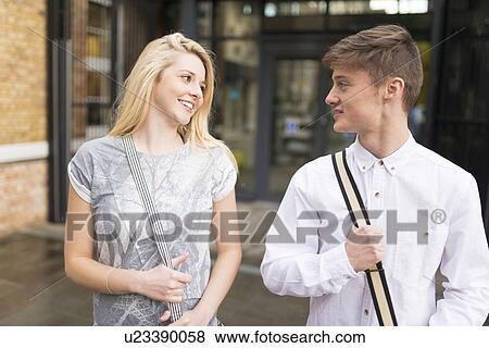 Young couple smiling View Large Photo Image Stock Photo - Young couple smiling. Fotosearch