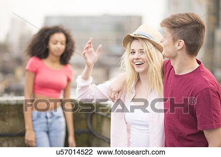 Young couple, woman wearing hat View Large Photo Image Stock Image - Young couple, woman wearing hat. Fotosearch
