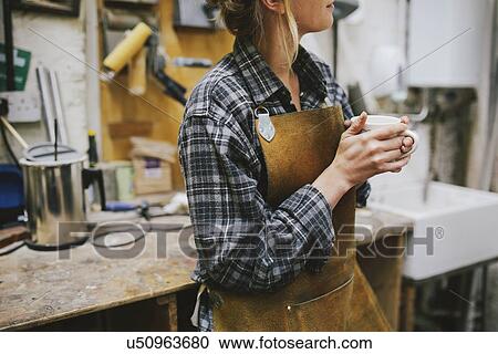 Young craftswoman drinking coffee in pipe organ workshop View Large Photo Image Stock Image - Young craftswoman drinking coffee in pipe organ workshop. Fotosearch