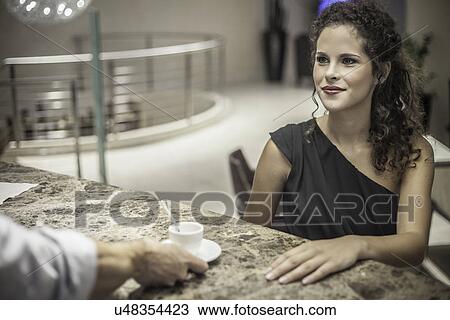 Young woman at coffee bar View Large Photo Image Stock Image - Young woman at coffee bar. Fotosearch