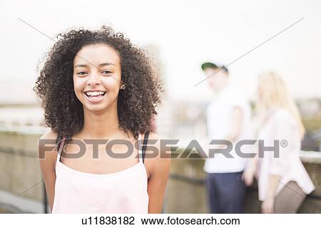 Young woman laughing View Large Photo Image Stock Image - Young woman laughing. Fotosearch