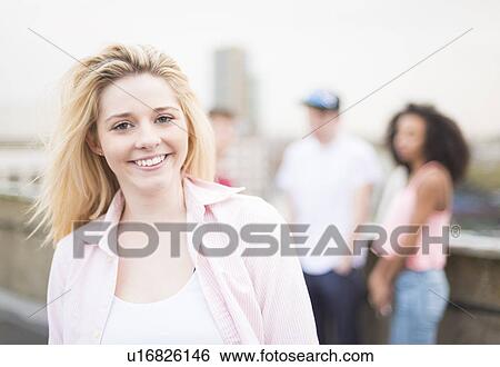 Stock Photograph - Young woman smiling. Fotosearch