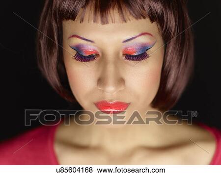 Stock Photo - Young woman wearing eye shadow. Fotosearch