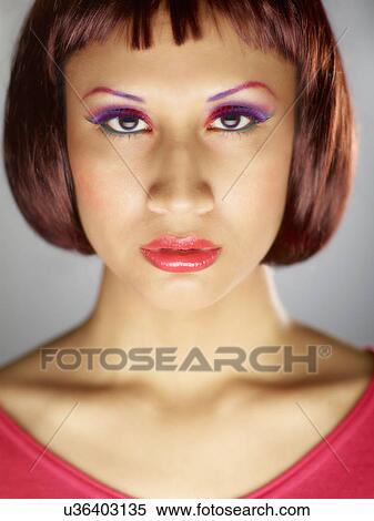 Stock Photography - Young woman wearing eye shadow. Fotosearch