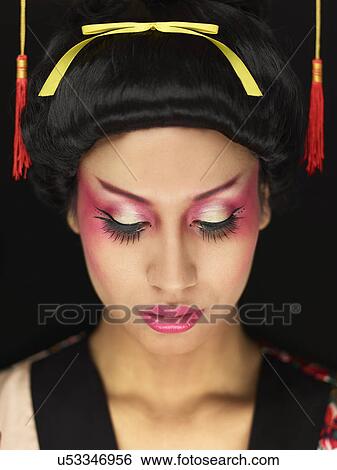 Stock Photograph - Young woman wearing Oriental style make up. Fotosearch
