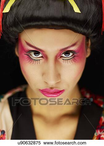 Young woman wearing Oriental style make up View Large Photo Image Stock Photography - Young woman wearing Oriental style make up. Fotosearch