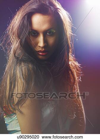 Young woman wearing rainbow coloured fake eyelashes View Large Photo Image Stock Image - Young woman wearing rainbow coloured fake eyelashes. Fotosearch