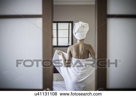 Stock Photo - Young woman wearing towel. Fotosearch
