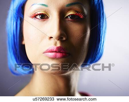Young woman with dyed blue hair View Large Photo Image Stock Image - Young woman with dyed blue hair. Fotosearch
