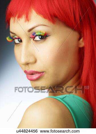 Stock Photograph - Young woman with dyed red hair. Fotosearch