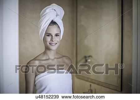 Young woman with towel on head View Large Photo Image Stock Photo - Young woman with towel on head. Fotosearch