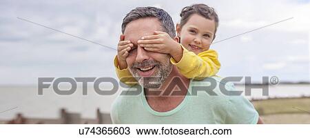 Daughter covering father's eyes View Large Photo Image Stock Image - Daughter covering father's eyes. Fotosearch