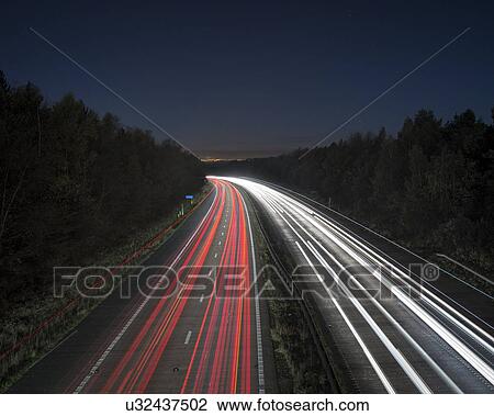Drawing - Evening rush hour on motorway. Fotosearch