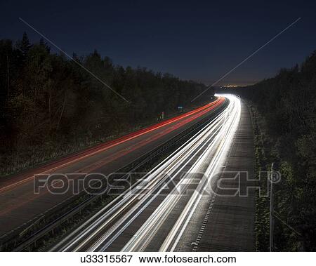 Stock Illustration - Evening rush hour on motorway. Fotosearch