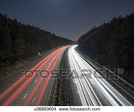 Stock Illustration - Evening rush hour on motorway. Fotosearch