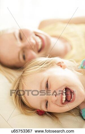 Mother and her daughter laughing View Large Photo Image Stock Photo - Mother and her daughter laughing. Fotosearch
