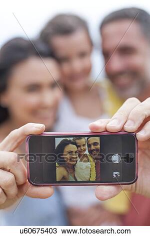 Parents taking family photograph View Large Photo Image Stock Image - Parents taking family photograph. Fotosearch