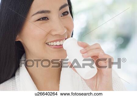Woman drinking health drink View Large Photo Image Picture - Woman drinking health drink. Fotosearch