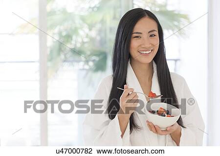 Woman holding bowl of fruit View Large Photo Image Stock Image - Woman holding bowl of fruit. Fotosearch