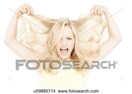 Picture - Woman holding long blonde hair. Fotosearch