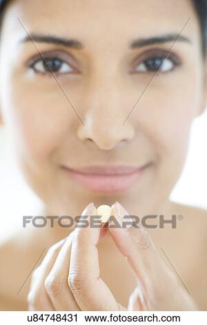 Woman holding tablet View Large Photo Image Stock Image - Woman holding tablet. Fotosearch