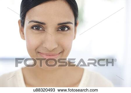 Stock Image - Woman looking at camera. Fotosearch